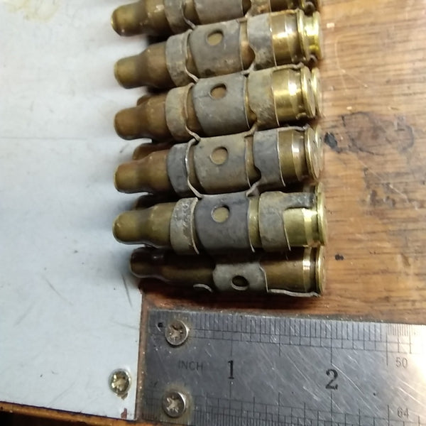 British Bullet Belt. 7.62 NATO. Sold Per INCH. Used / Graded. Brass / Steel